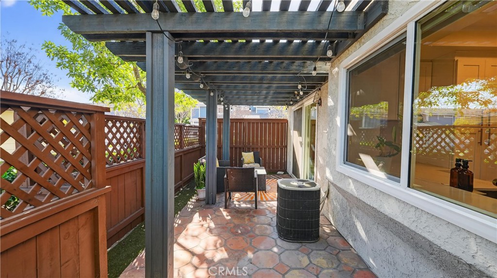 1761 Forum Way, Unit D Corona, CA 92881 - Photo 26 of 39 a porch with a table and chairs