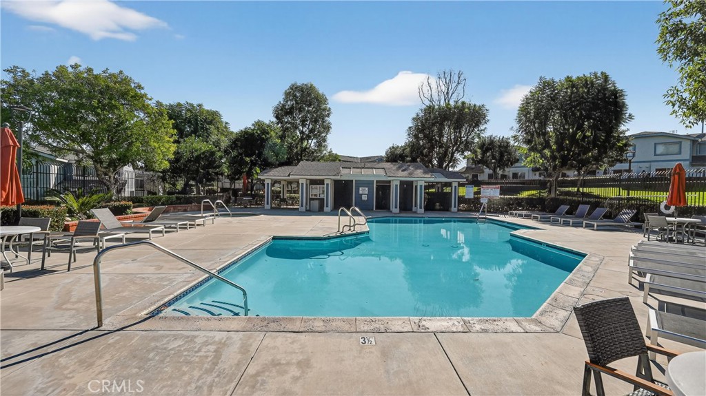 1761 Forum Way, Unit D Corona, CA 92881 - Photo 30 of 39 a view of a swimming pool with chairs