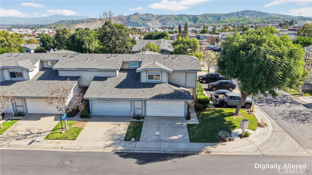 1761 Forum Way, Unit D Corona, CA 92881 - Photo 3 of 39 an aerial view of a house with a garden and balcony