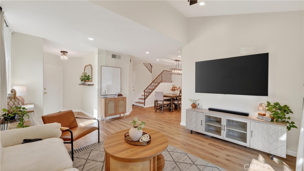 1761 Forum Way, Unit D Corona, CA 92881 - Photo 5 of 39 a living room with furniture and a flat screen tv