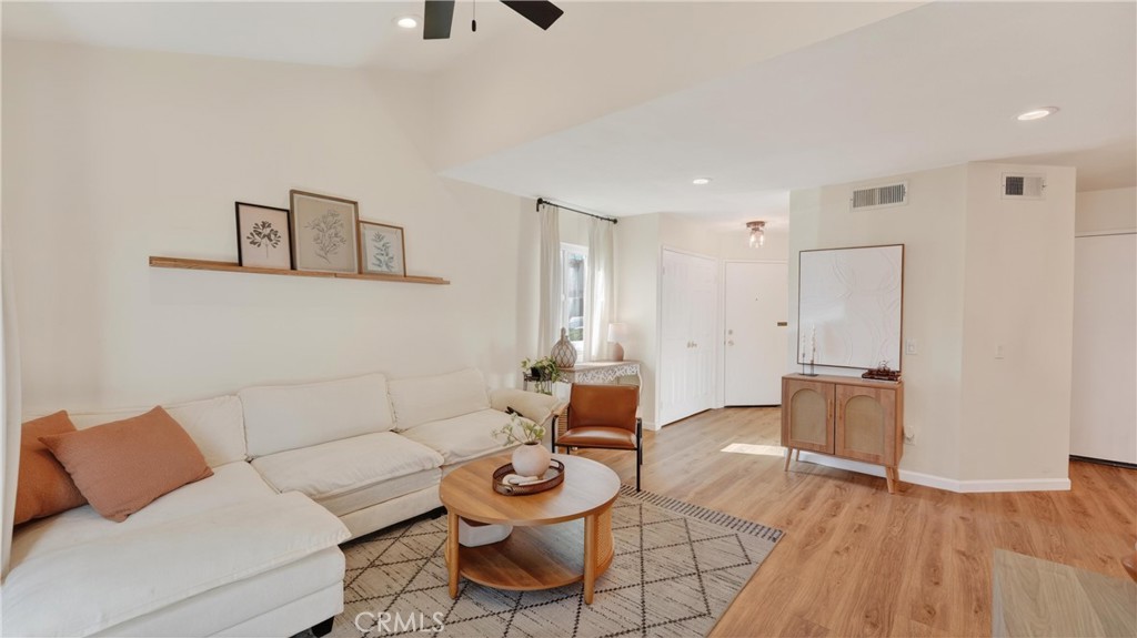 1761 Forum Way, Unit D Corona, CA 92881 - Photo 6 of 39 a living room with furniture and wooden floor