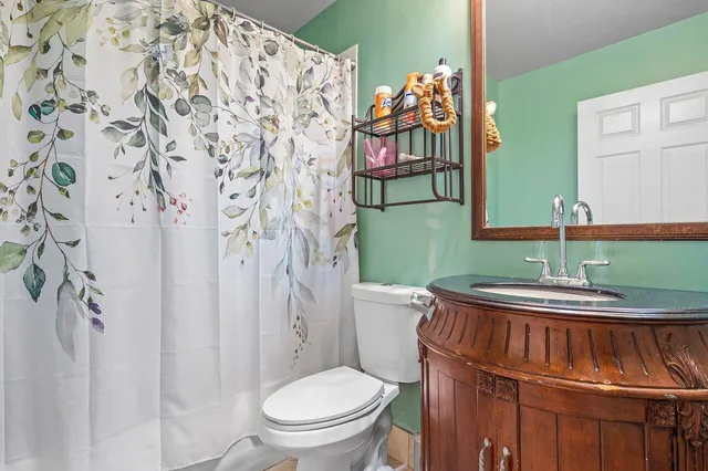 a bathroom with a toilet and a sink