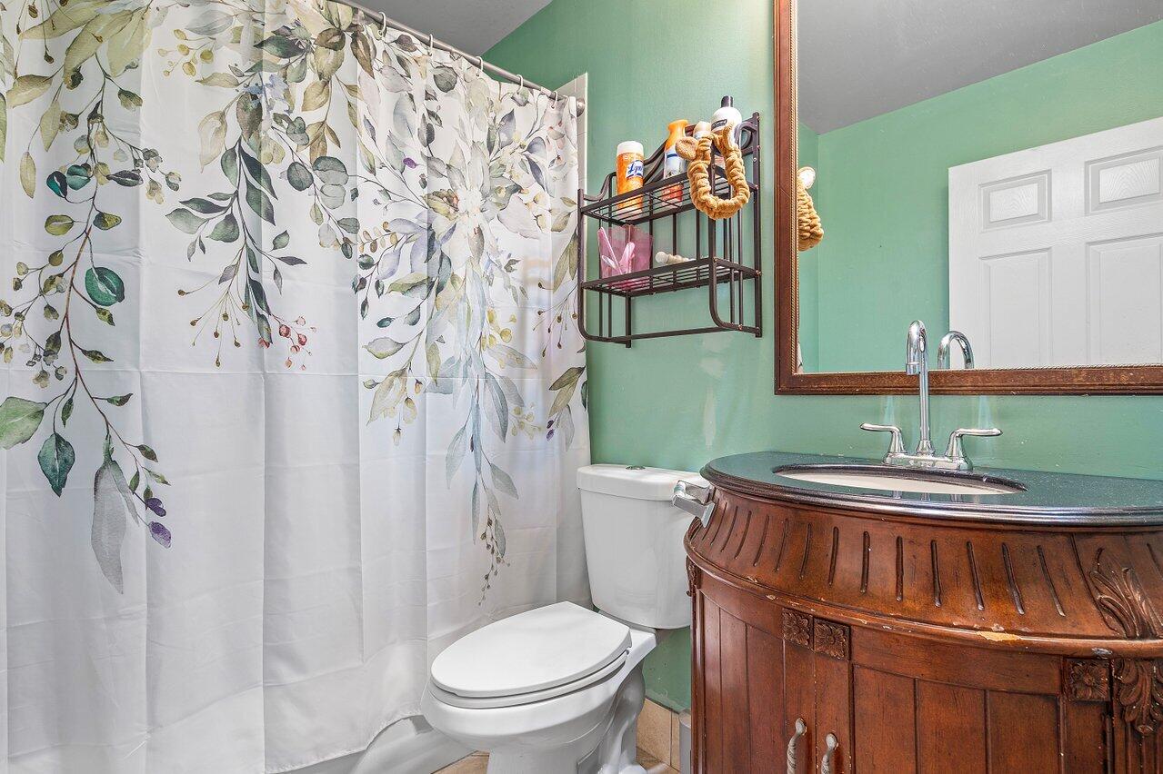 177 Heming Way Boynton Beach, FL 33426 - Photo 14 of 22 a bathroom with a toilet and a sink