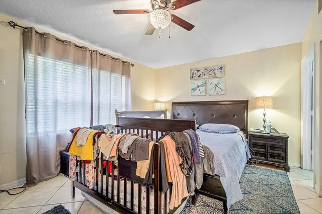 a bedroom with furniture and a window