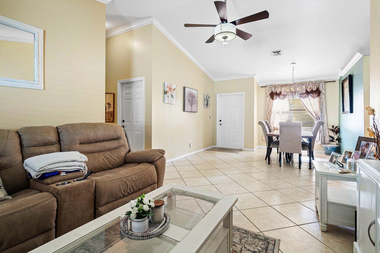 177 Heming Way Boynton Beach, FL 33426 - Photo 9 of 22 a living room with furniture and kitchen view