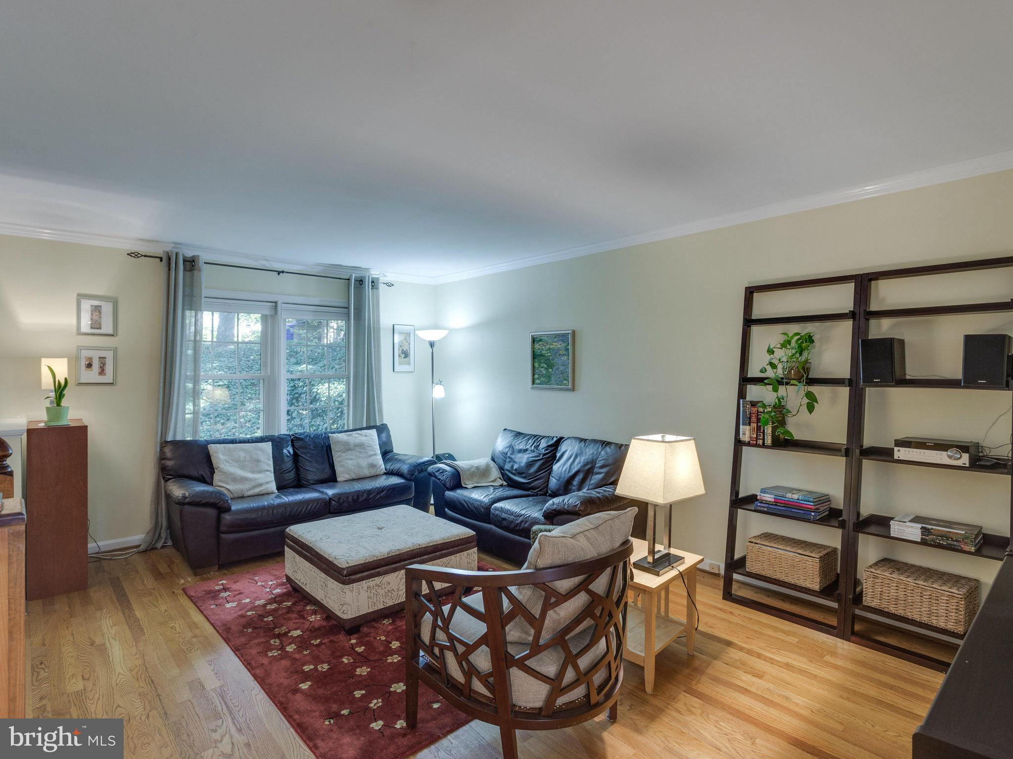 2071 South Glebe Road Arlington, VA 22206 - Photo 2 of 19 a living room with furniture and a wooden floor