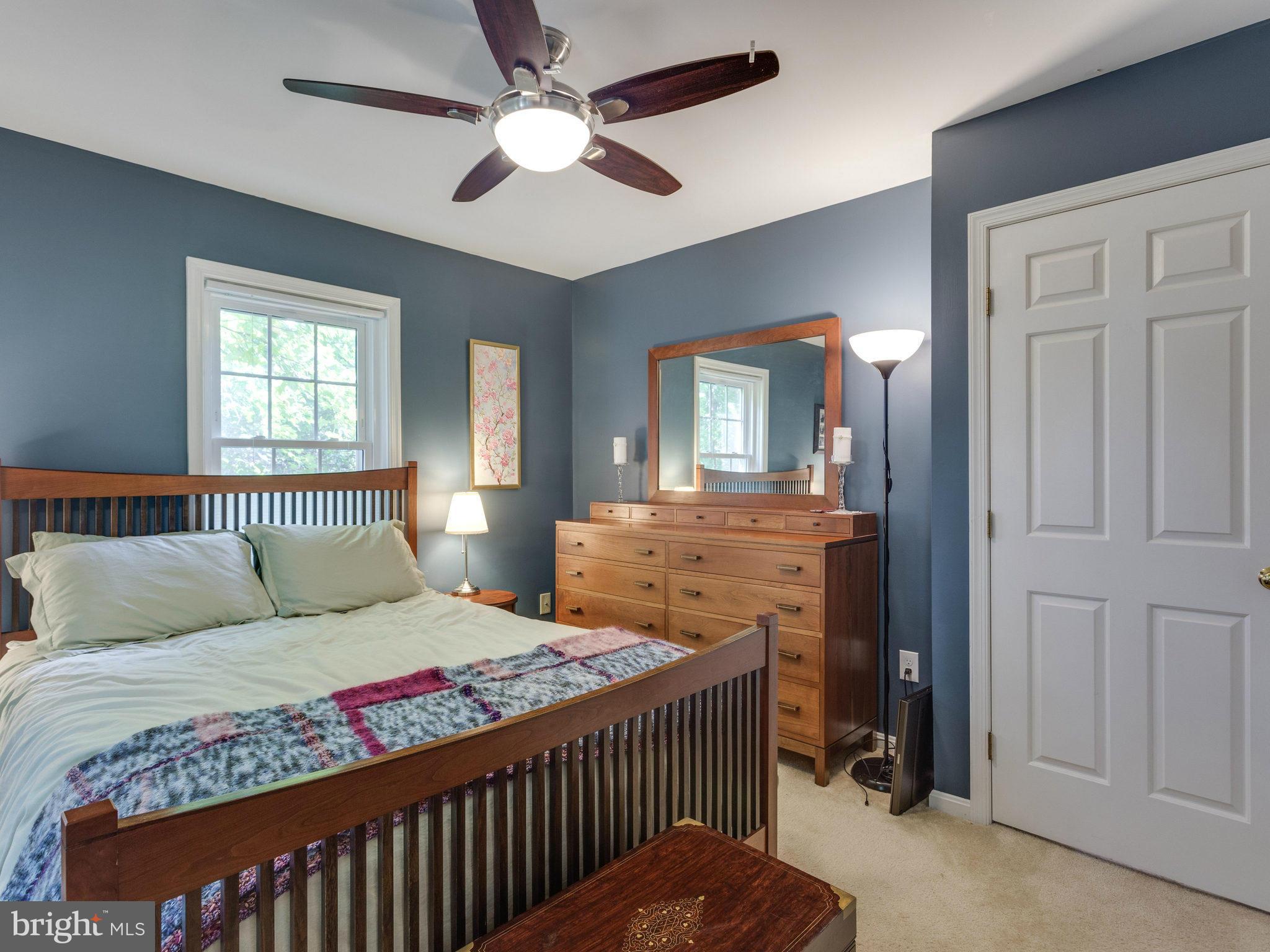 2071 South Glebe Road Arlington, VA 22206 - Photo 11 of 19 a living room with a bed furniture and a chandelier