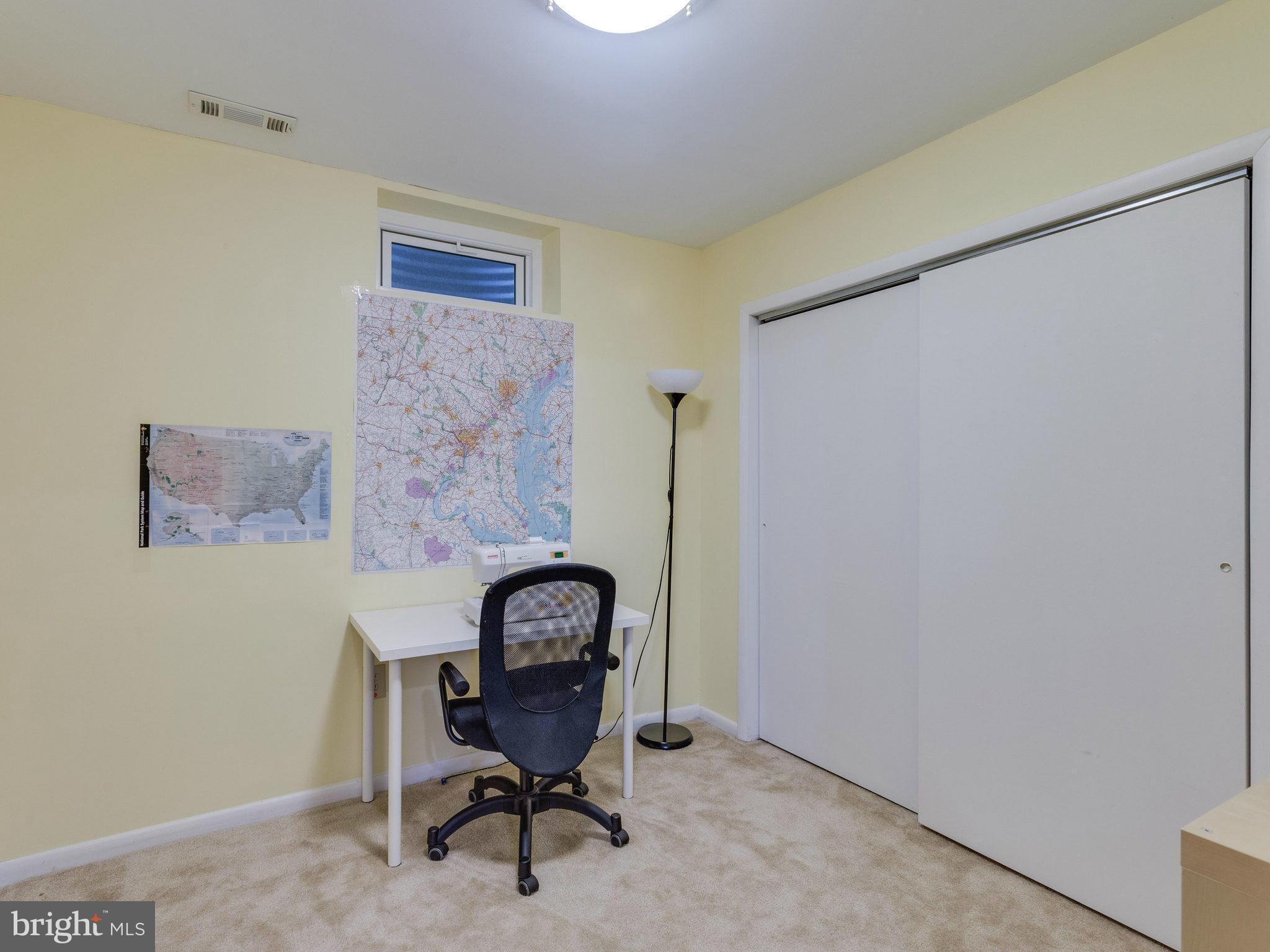 2071 South Glebe Road Arlington, VA 22206 - Photo 15 of 19 a view of a workspace with furniture and a window