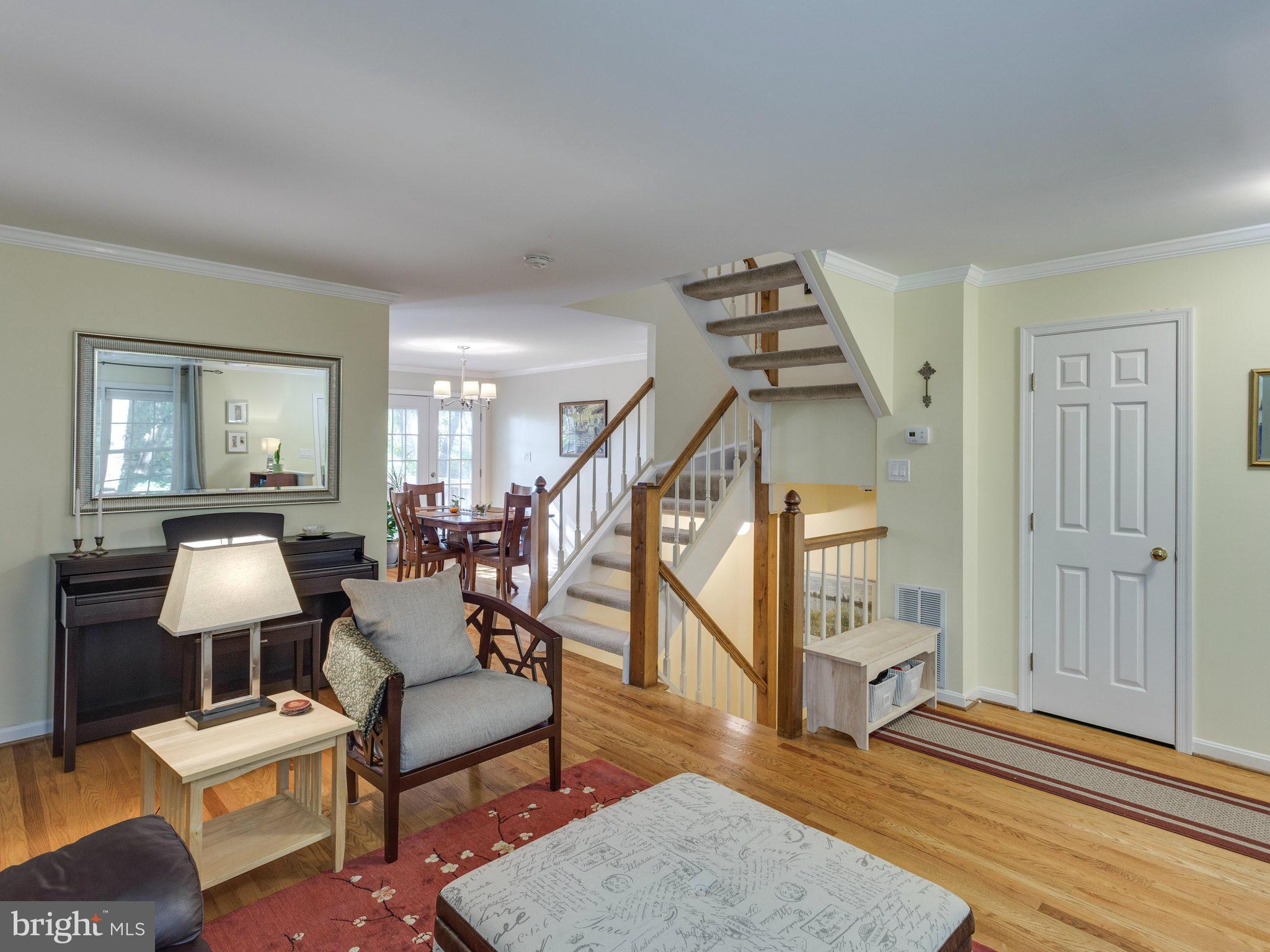 2071 South Glebe Road Arlington, VA 22206 - Photo 3 of 19 a living room with furniture and wooden floor