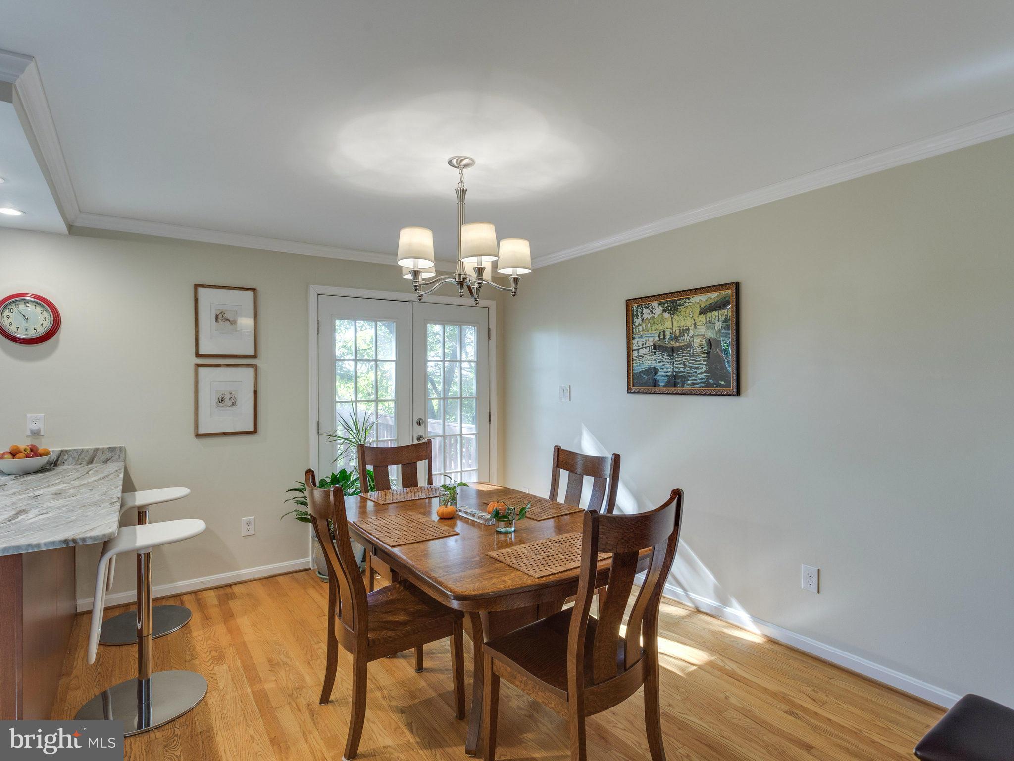 2071 South Glebe Road Arlington, VA 22206 - Photo 4 of 19 a view of a dining room with furniture and chandelier