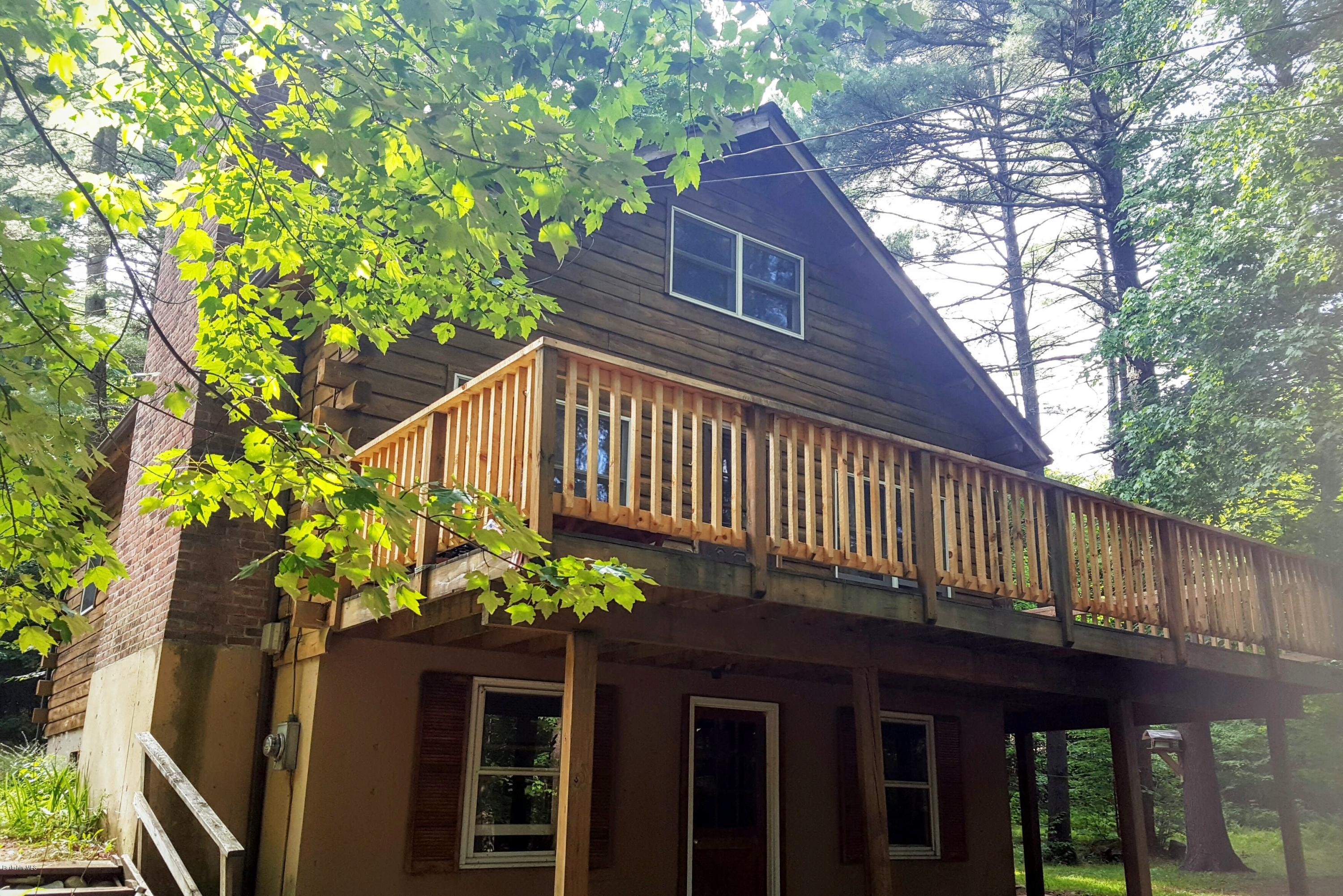 514 South Main Road Otis, MA 01253 - Photo 1 of 21 a backyard of a house with lots of green space