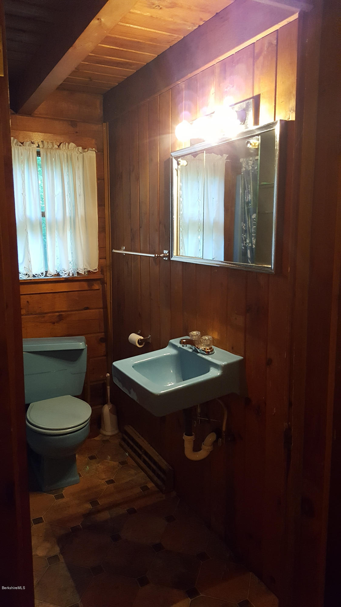 514 South Main Road Otis, MA 01253 - Photo 17 of 21 a bathroom with a sink and a mirror