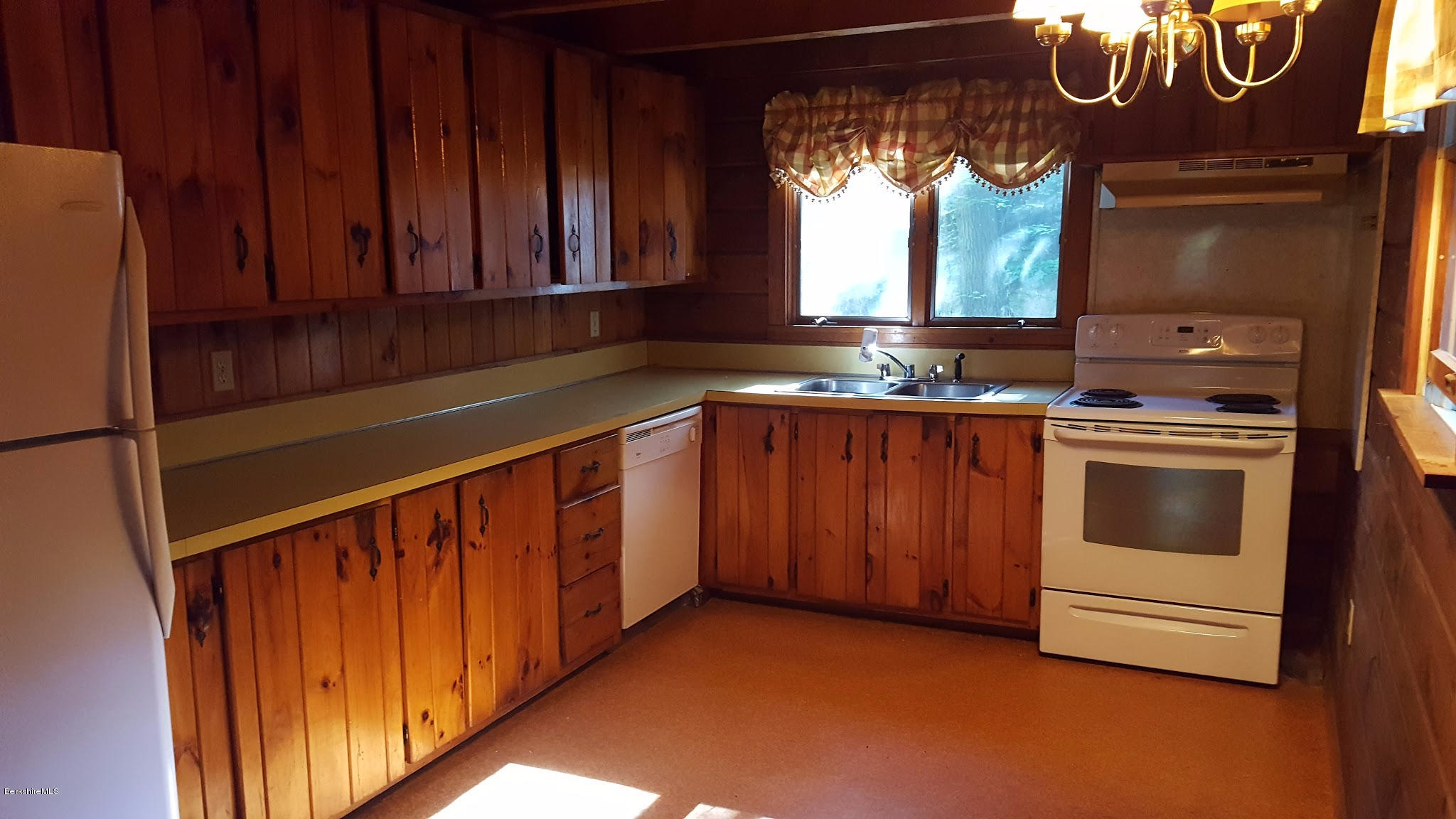 514 South Main Road Otis, MA 01253 - Photo 5 of 21 a kitchen that has a sink and a stove