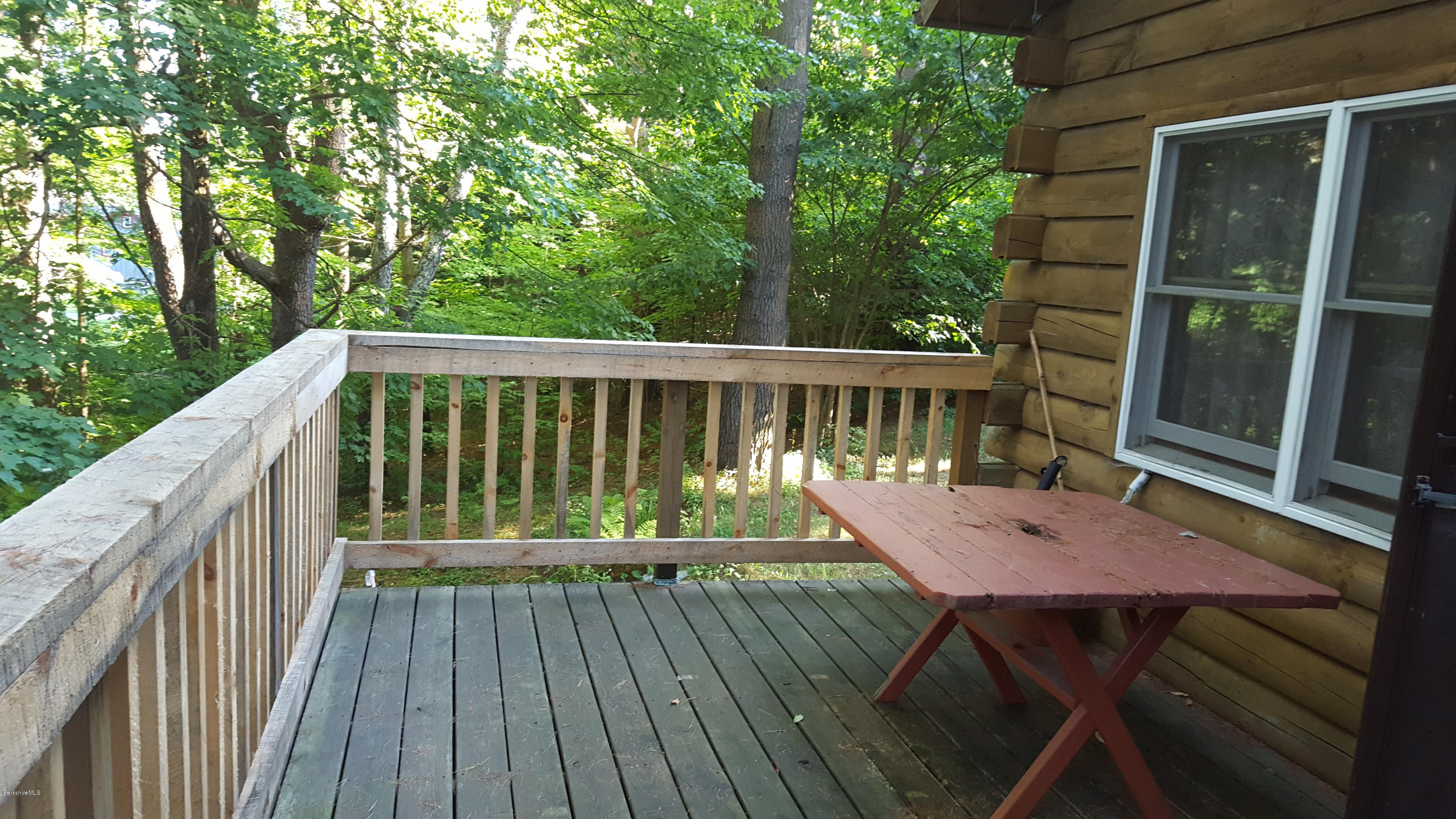 514 South Main Road Otis, MA 01253 - Photo 8 of 21 a view of a wooden deck and outdoor seating