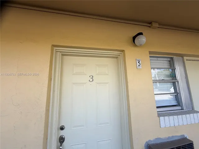 a bathroom with a shower and a window