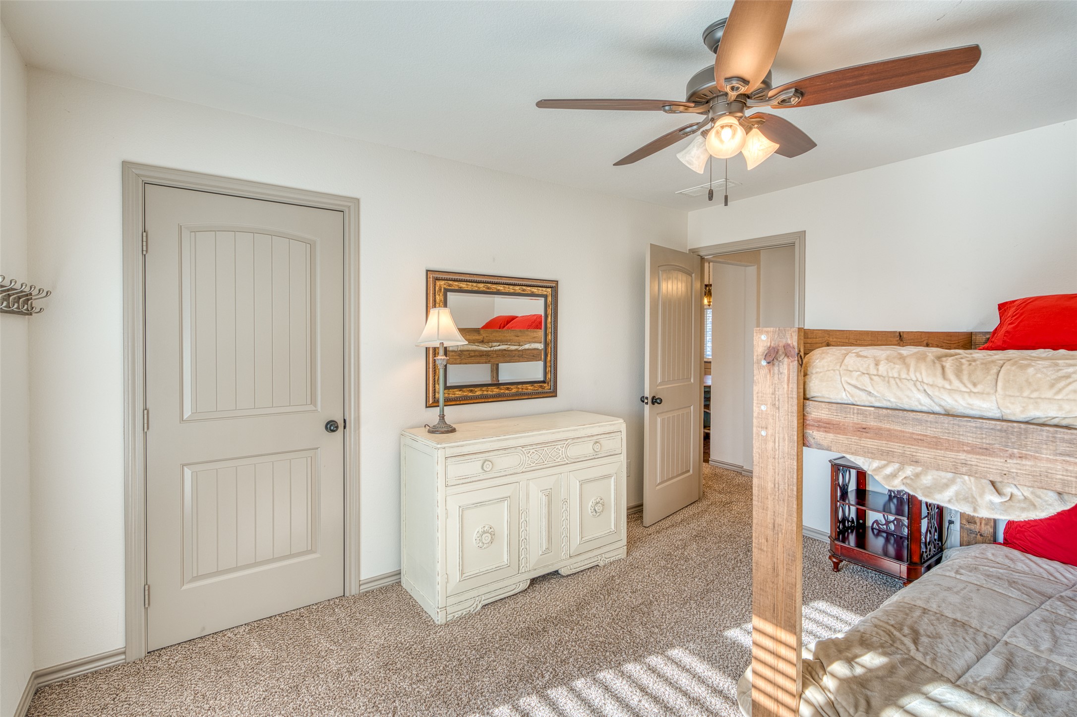 489 Nordic Ridge Road Bertram, TX 78605 - Photo 7 of 19 Bedroom featuring light colored carpet and ceiling fan