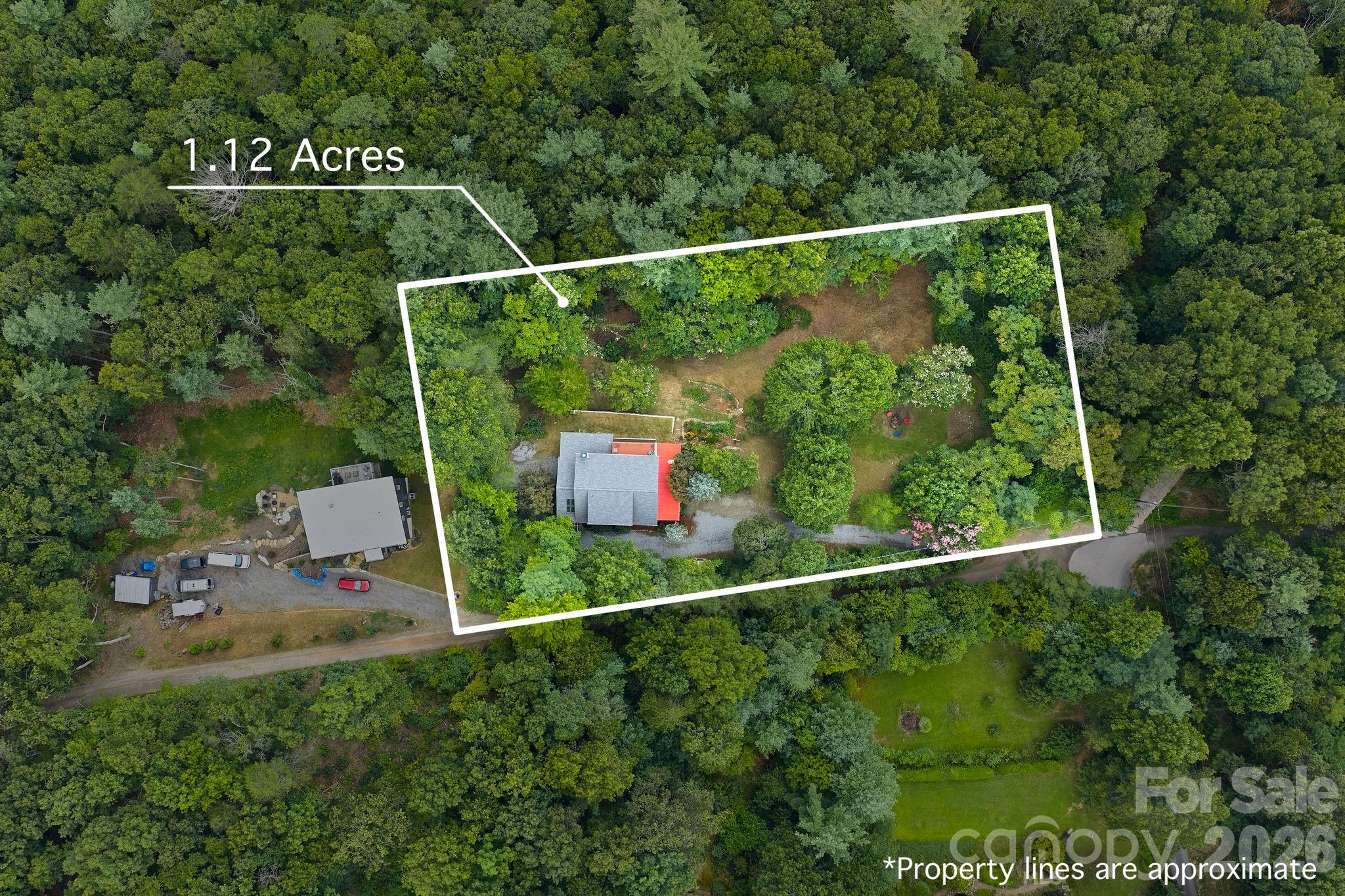 150 Avondale Ridge Road Asheville, NC 28803 - Photo 6 of 45 a view of a yard in front of house and tree