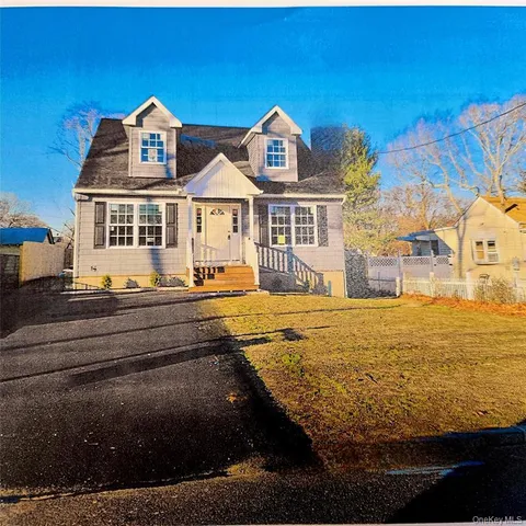 a front view of a house with a ocean view