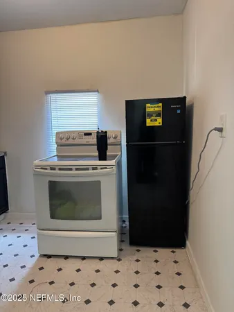 a view of a hallway with washer and dryer