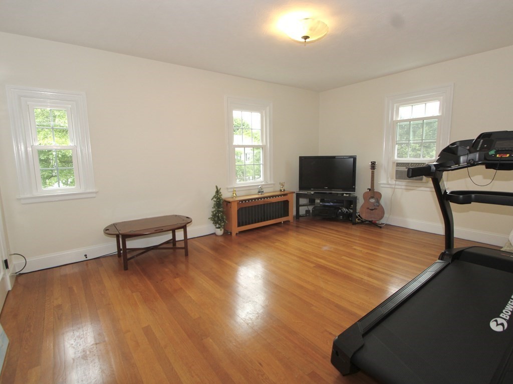 16 Thorndyke Road Worcester, MA 01606 - Photo 11 of 17 a living room with furniture and a flat screen tv