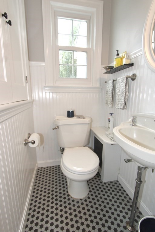 16 Thorndyke Road Worcester, MA 01606 - Photo 8 of 17 a bathroom with a sink toilet a mirror and shower
