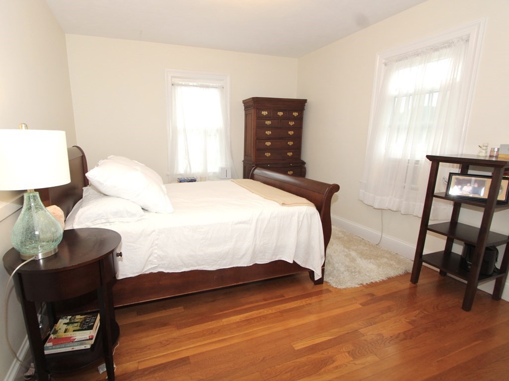 16 Thorndyke Road Worcester, MA 01606 - Photo 10 of 17 a bedroom with a bed and a chair in it