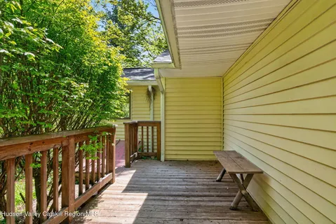 a view of balcony with wooden floor