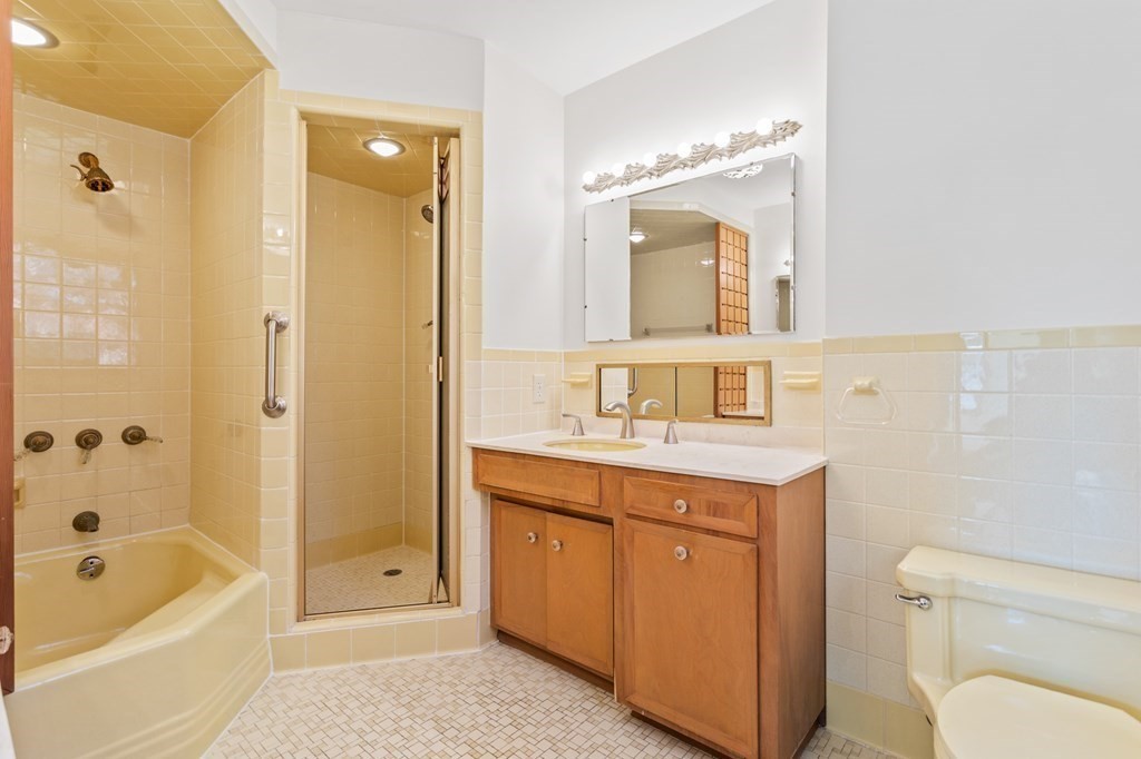 263 Lincoln Road Lincoln, MA 01773 - Photo 16 of 37 a bathroom with a sink a toilet and shower