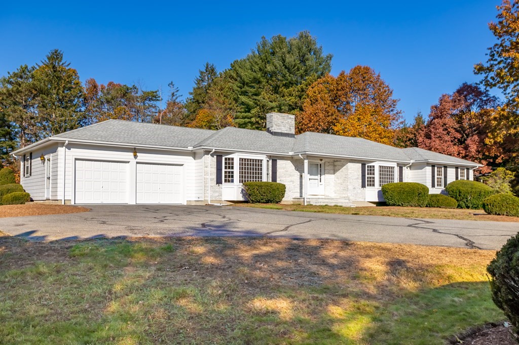 263 Lincoln Road Lincoln, MA 01773 - Photo 2 of 37 a front view of a house with a garden