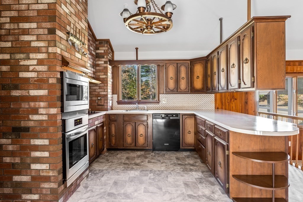 263 Lincoln Road Lincoln, MA 01773 - Photo 5 of 37 a kitchen with stainless steel appliances granite countertop a stove and a sink