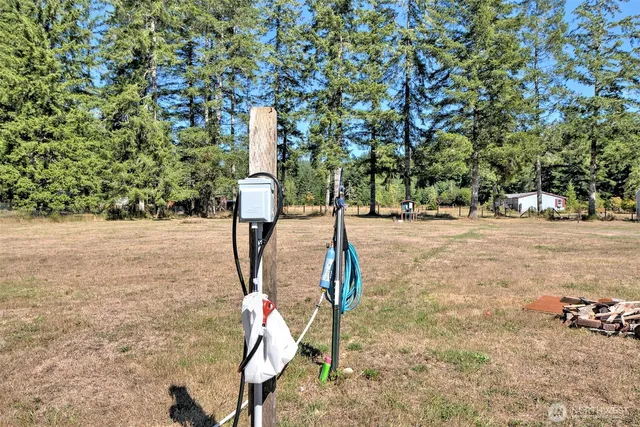a backyard of a house with table and chairs
