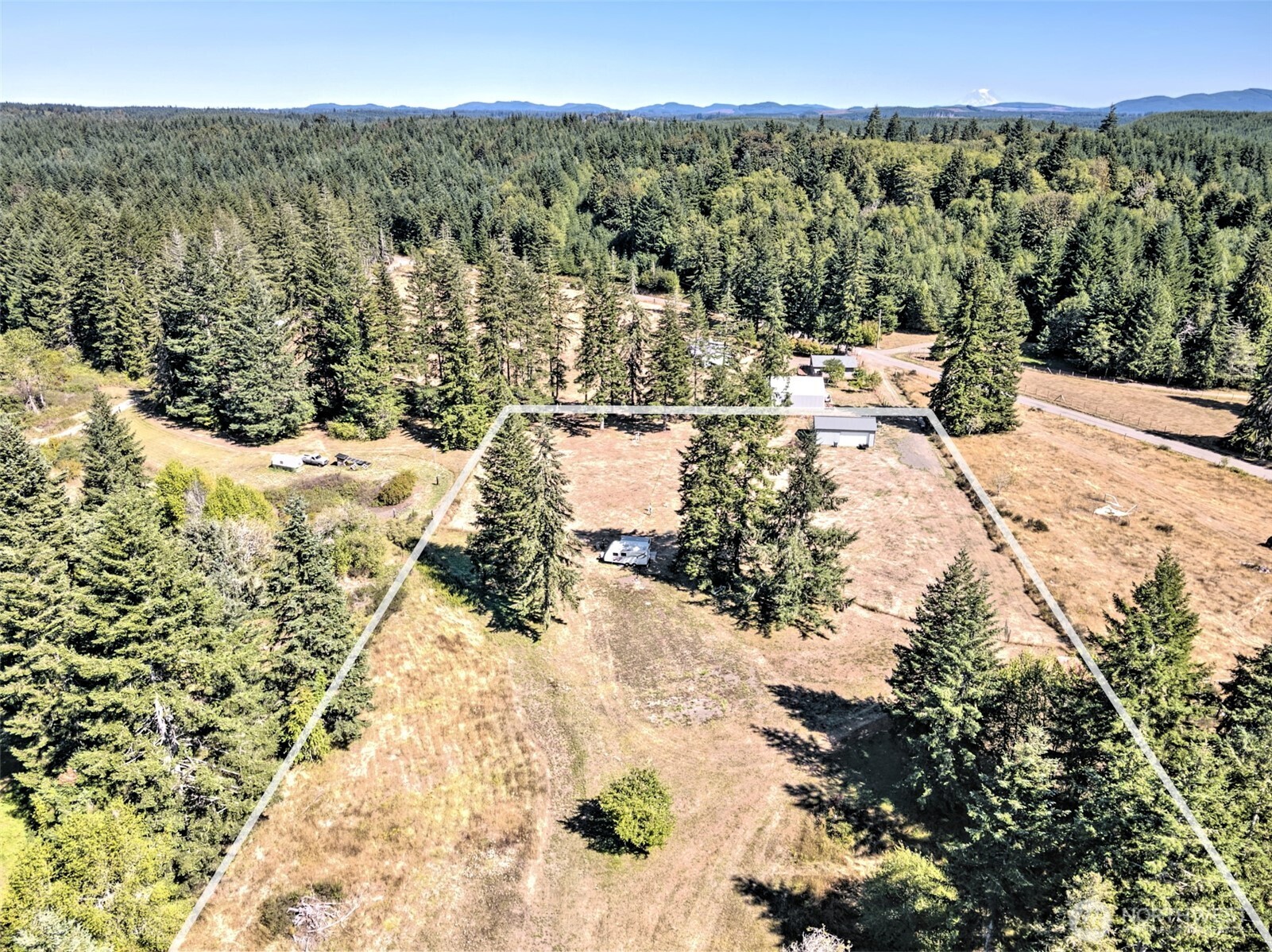 1982 West Ford Loop Road Elma, WA 98541 - Photo 4 of 29 a view of a yard with wooden fence