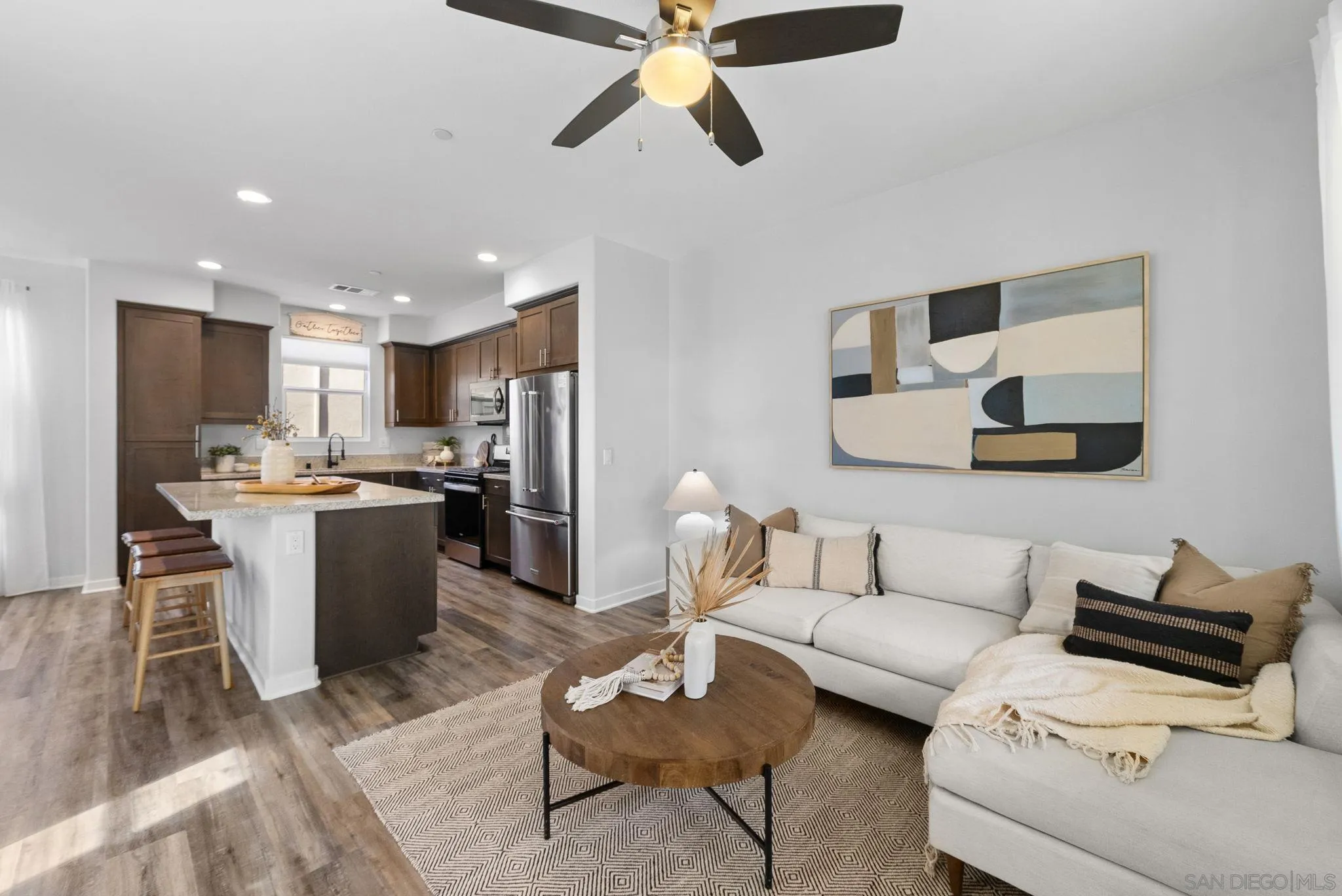 4229 Mission Ranch Way Oceanside, CA 92057 - Photo 1 of 26 a living room with furniture and kitchen view