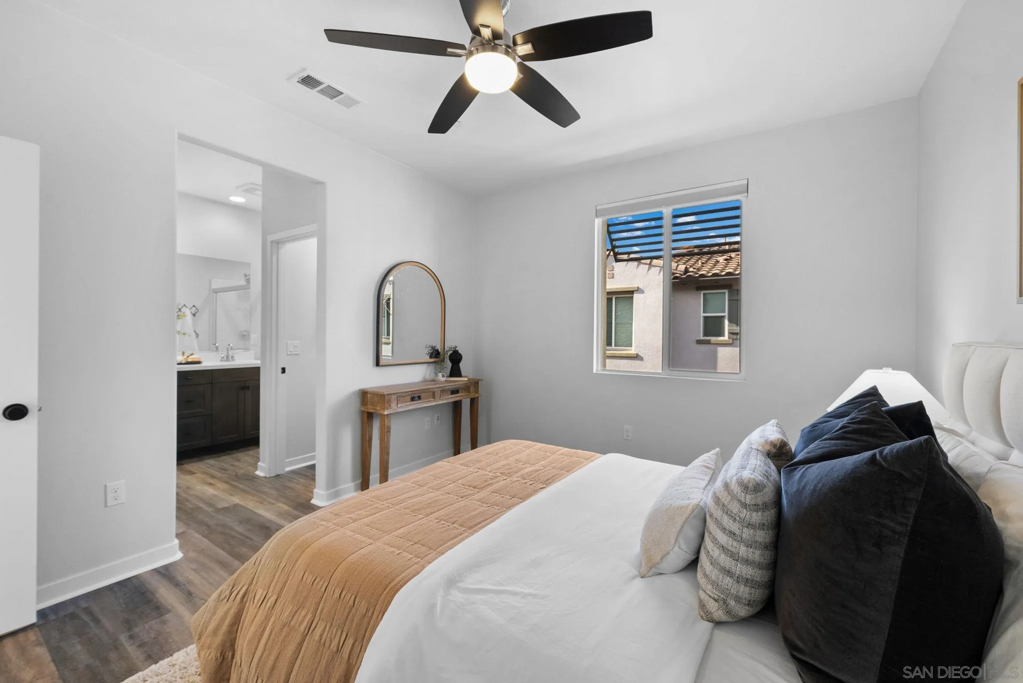 4229 Mission Ranch Way Oceanside, CA 92057 - Photo 11 of 26 a bedroom with a bed and a dresser