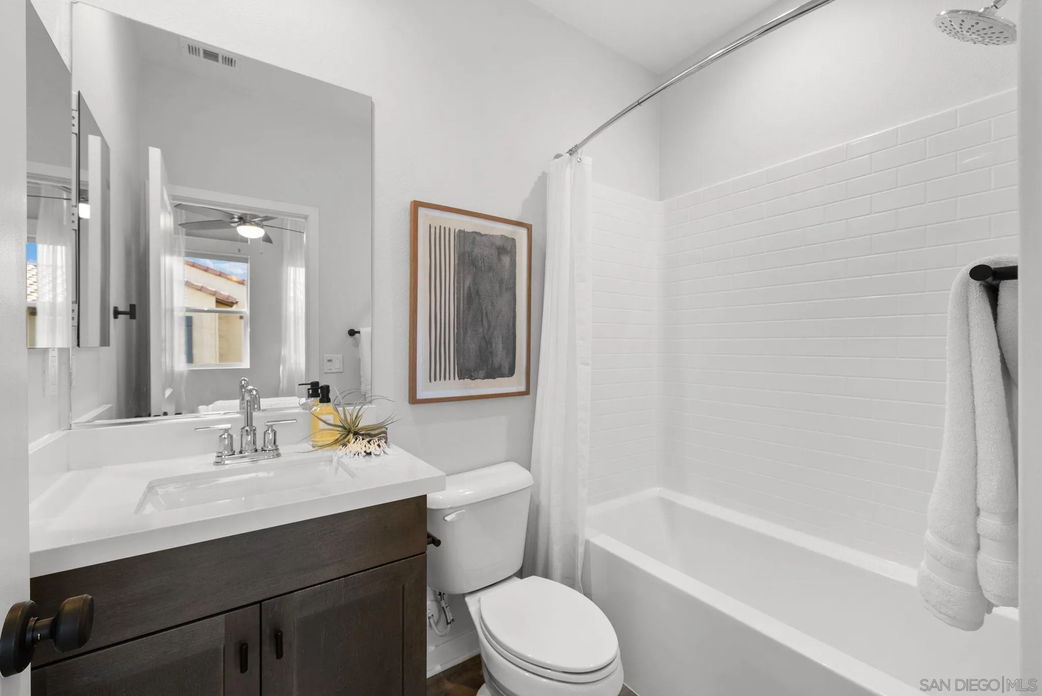 4229 Mission Ranch Way Oceanside, CA 92057 - Photo 17 of 26 a bathroom with a sink a toilet and shower