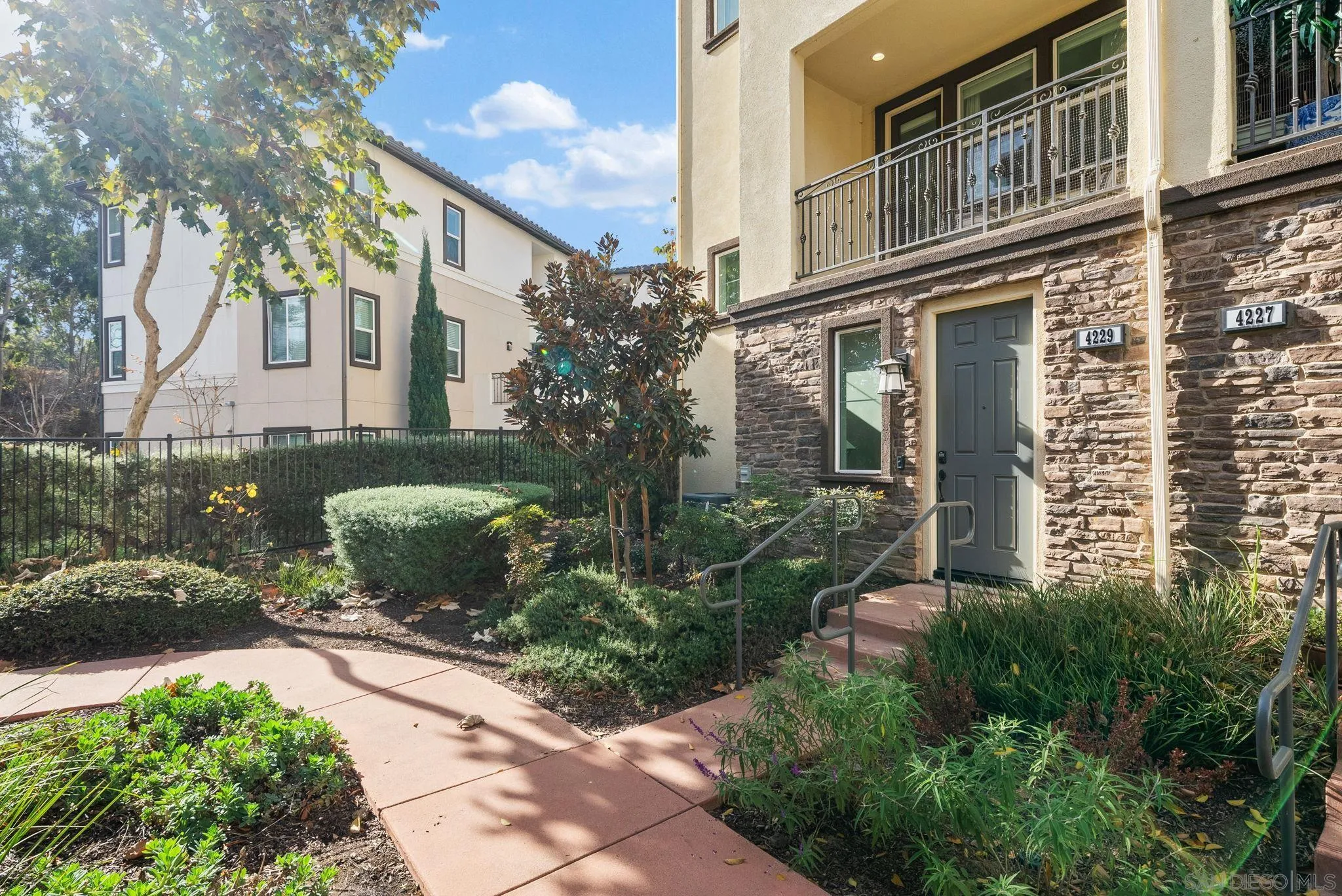 4229 Mission Ranch Way Oceanside, CA 92057 - Photo 18 of 26 a view of a building with a garden