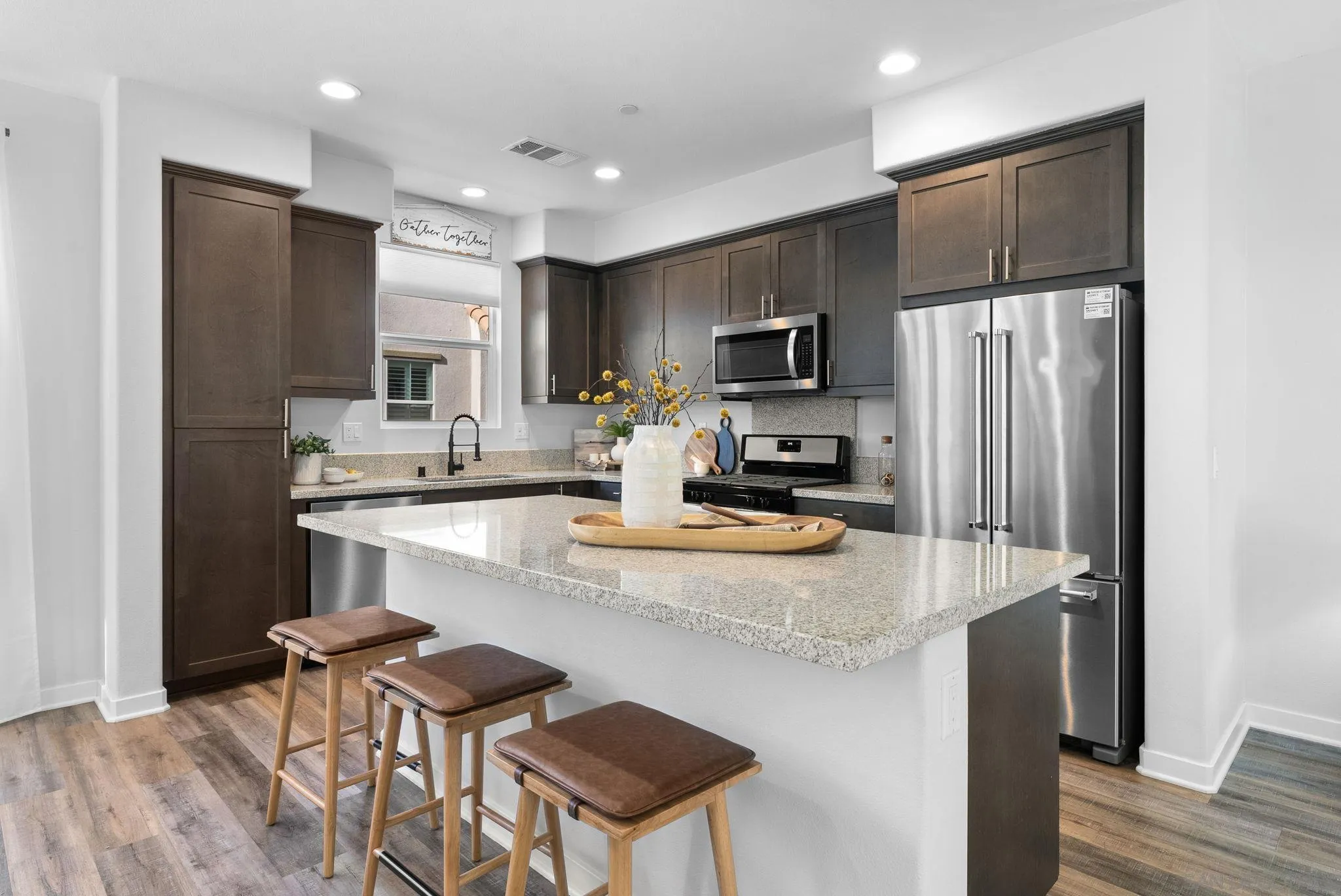 4229 Mission Ranch Way Oceanside, CA 92057 - Photo 3 of 26 a kitchen with kitchen island a counter top space cabinets and stainless steel appliances