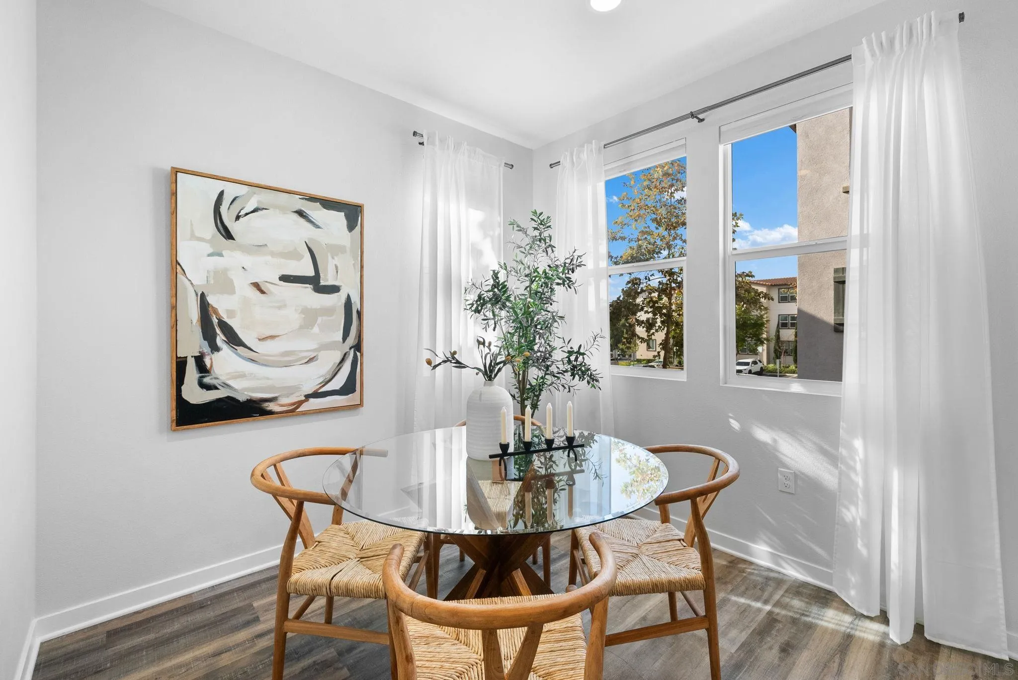 4229 Mission Ranch Way Oceanside, CA 92057 - Photo 8 of 26 a view of a dining room with furniture and wooden floor