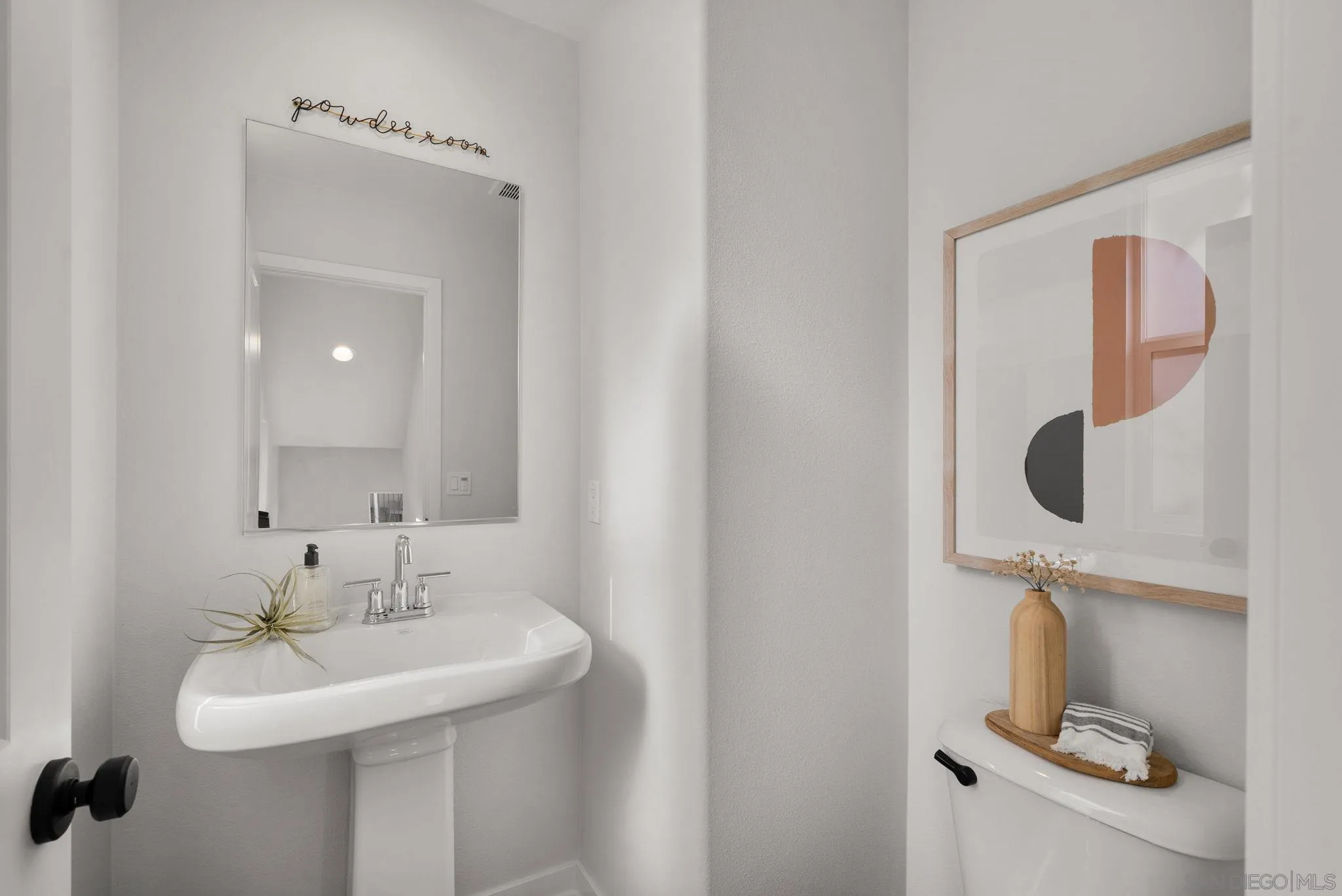 4229 Mission Ranch Way Oceanside, CA 92057 - Photo 9 of 26 a bathroom with a sink and mirror