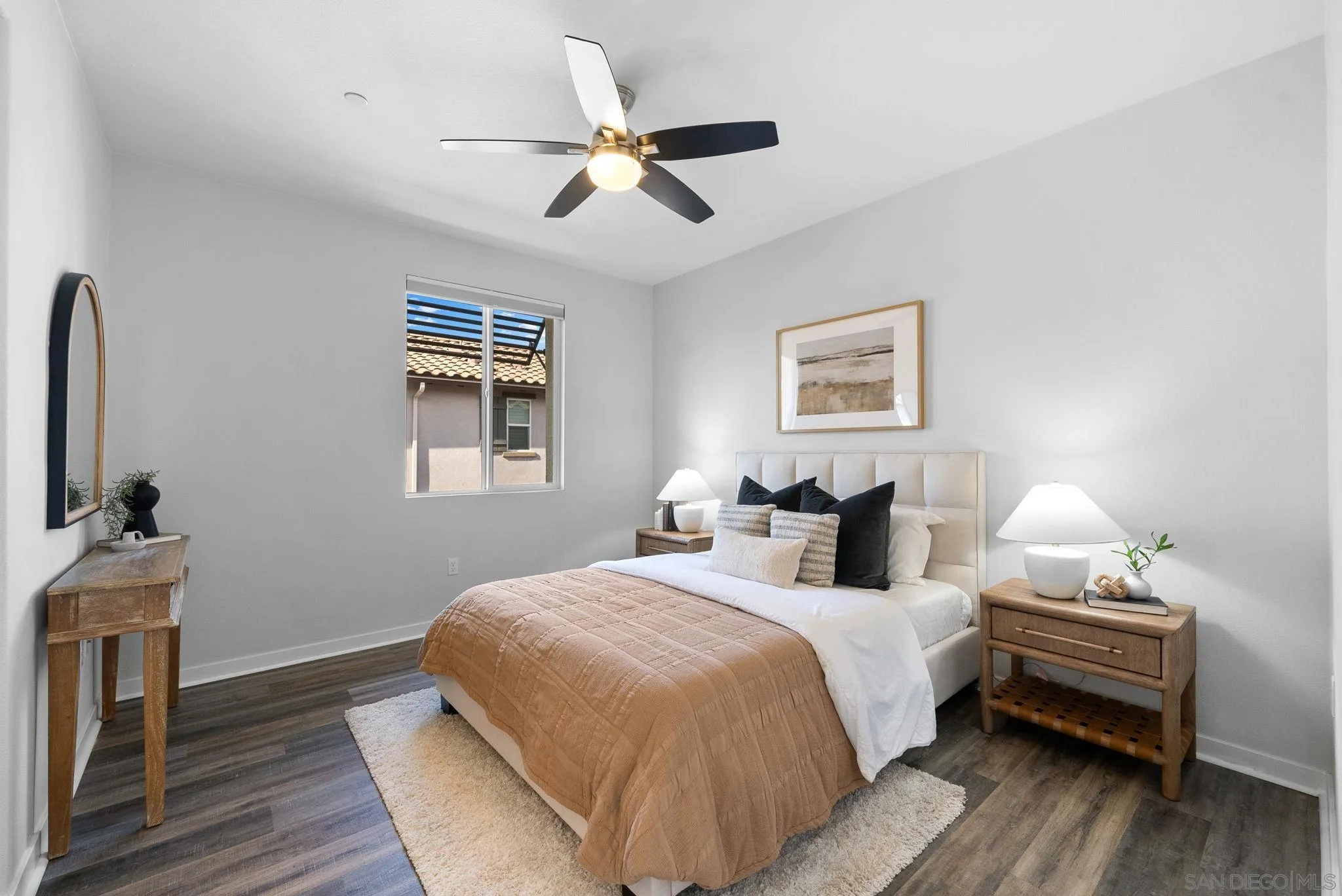 4229 Mission Ranch Way Oceanside, CA 92057 - Photo 10 of 26 a bedroom with a bed and a chandelier