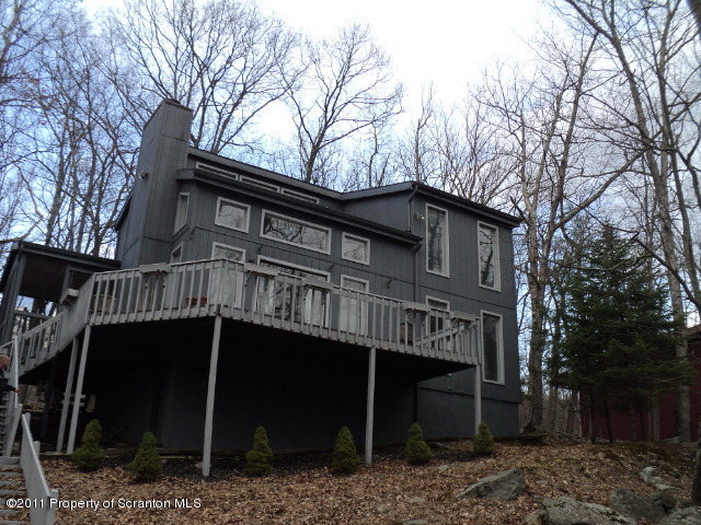 1037 Decker Road Bushkill, PA 18324 - Photo 1 of 8 a view of a house with a yard