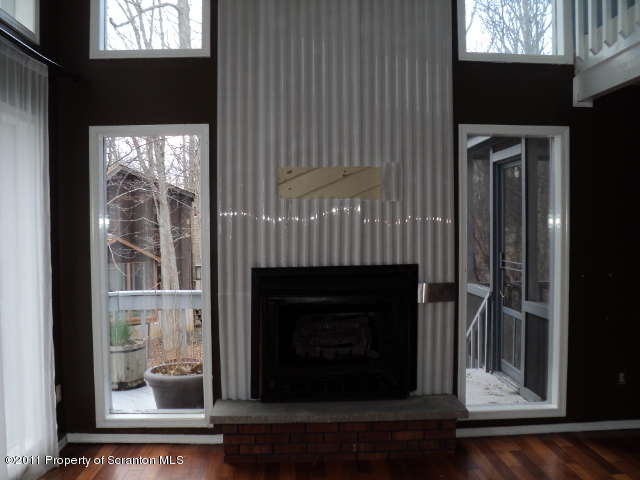1037 Decker Road Bushkill, PA 18324 - Photo 4 of 8 a view of fireplace with wooden floor
