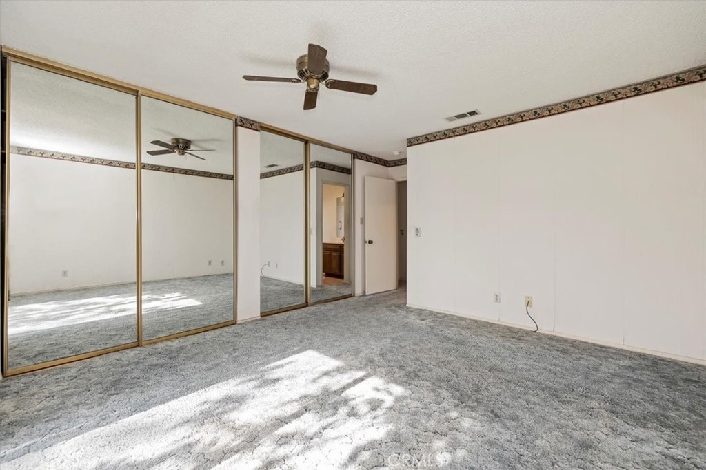 1825 Flame Tree Way Hemet, CA 92545 - Photo 18 of 23 a view of an empty room with a window