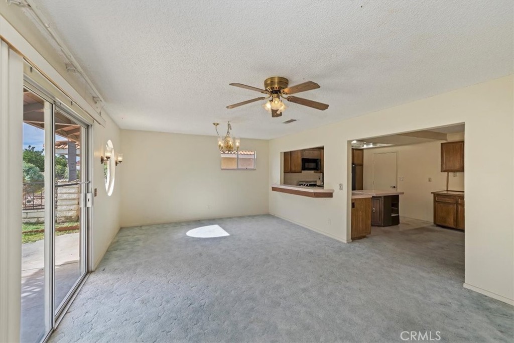 1825 Flame Tree Way Hemet, CA 92545 - Photo 8 of 23 wooden floor in an empty room with a window