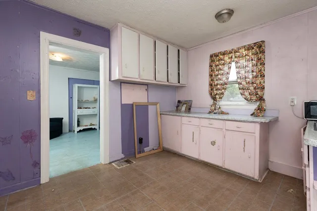 a view of a porch with a floor to ceiling window