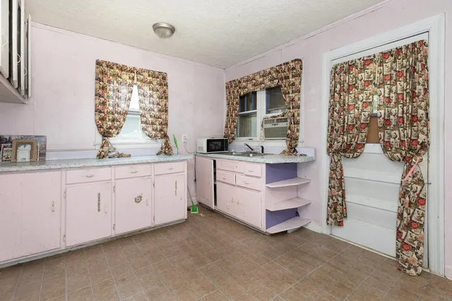 a view of an empty room and window