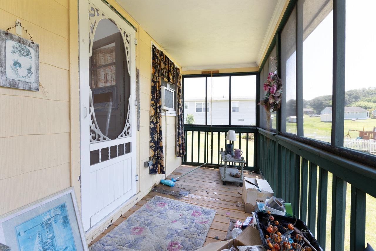 711 8th Street Shenandoah, VA 22849 - Photo 17 of 60 a view of a porch with a floor to ceiling window