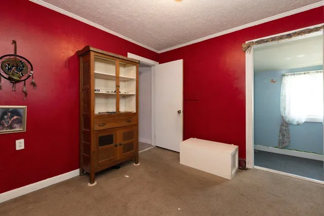 a bathroom with a granite countertop toilet sink and mirror