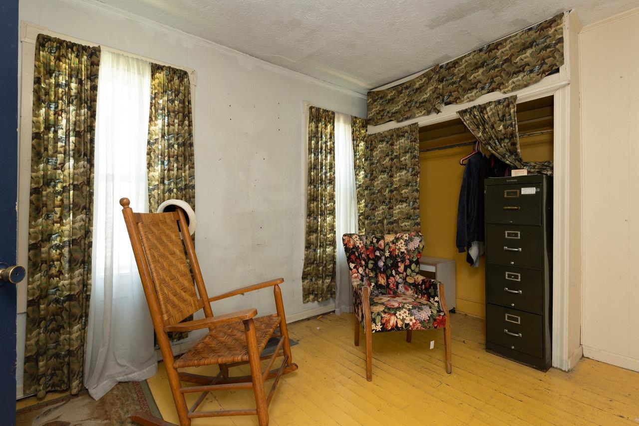 711 8th Street Shenandoah, VA 22849 - Photo 24 of 60 a bedroom with a bed and a chair