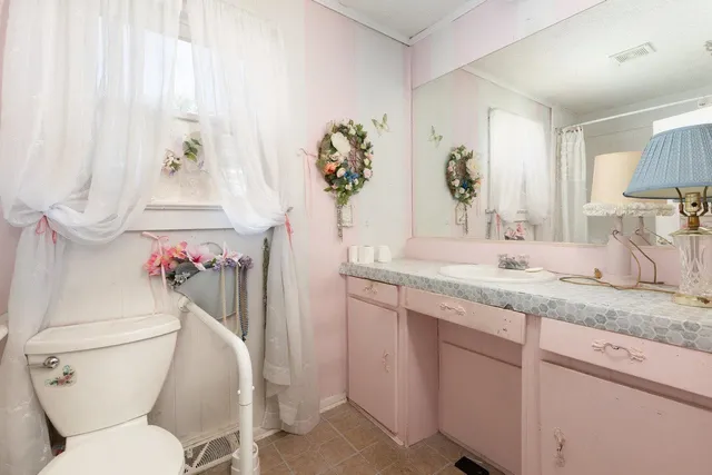 a view of a house with swimming pool and a yard